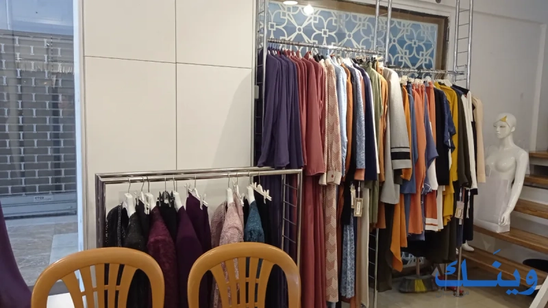 التاجر